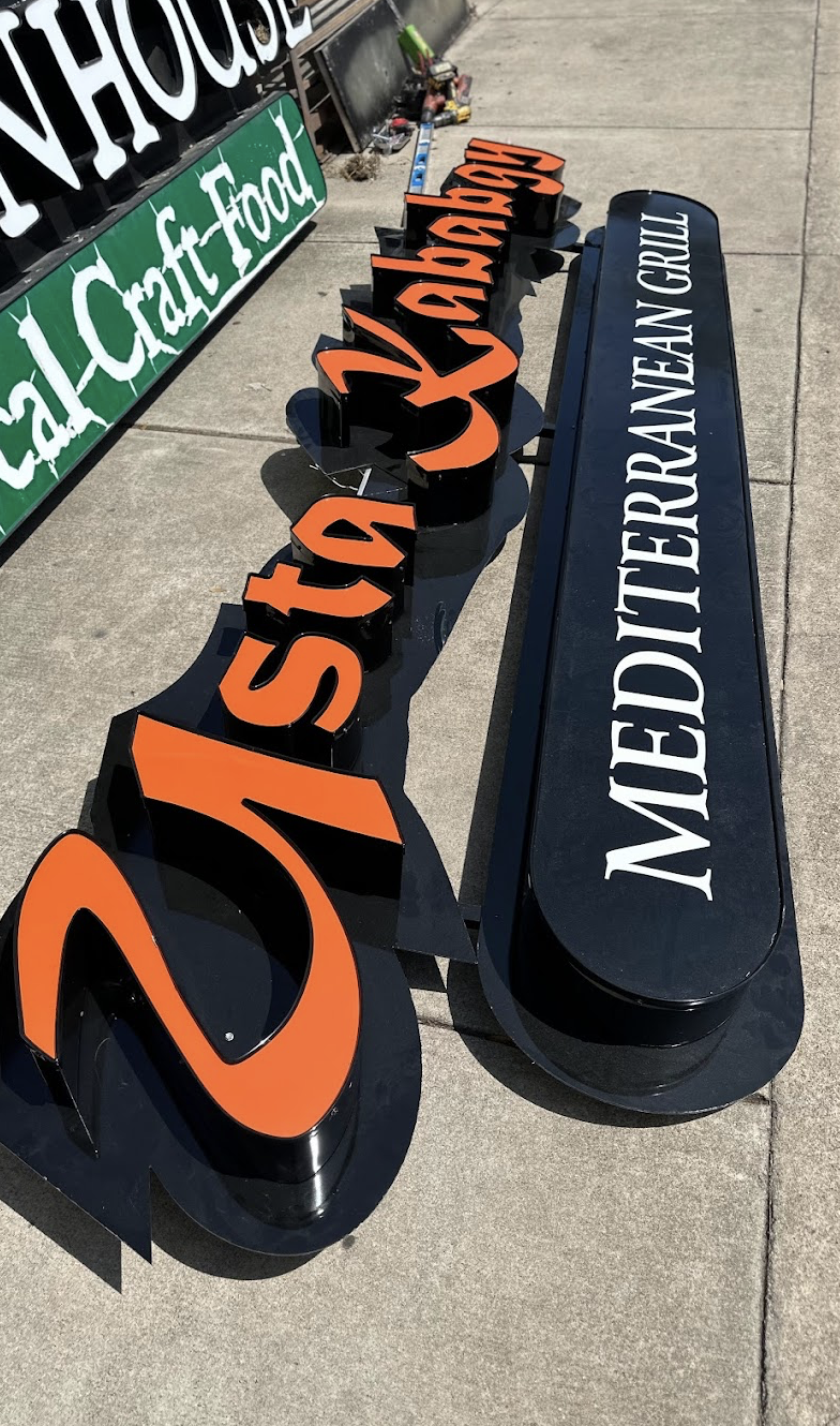 signage for mediterranean restaurant ready to be installed